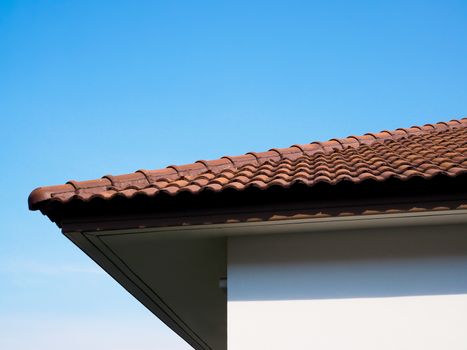 construction roof of house built with clay tiles, home with blue sky background, Buildings in Asia, Thailand style.