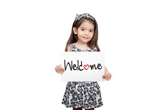 Business welcome concept, Cute girl holding a welcome sign standing on white background. Cute mixed race girl half Thai, half English model 3 years old.