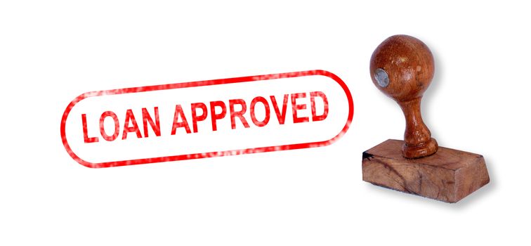 Top view of a rubber stamp with a giant word "LOAN APPROVED" printed, isolated on white background.