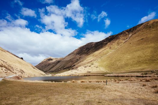 The stunning idyllic Moke Lake near Queenstown in Otago, New Zealand. This secluded, peaceful lake is a popular locale for camping, boating, hiking and horseback riding.