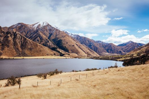 The stunning idyllic Moke Lake near Queenstown in Otago, New Zealand. This secluded, peaceful lake is a popular locale for camping, boating, hiking and horseback riding.
