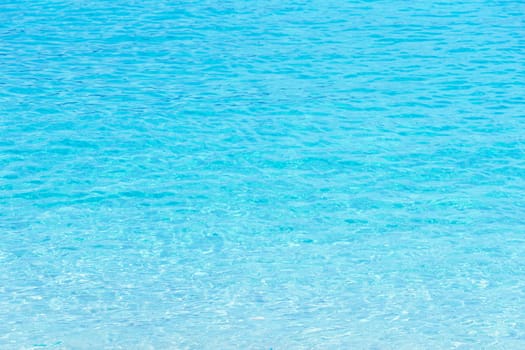 Transparent blue sea water background in Tropical summer beach, summer background.