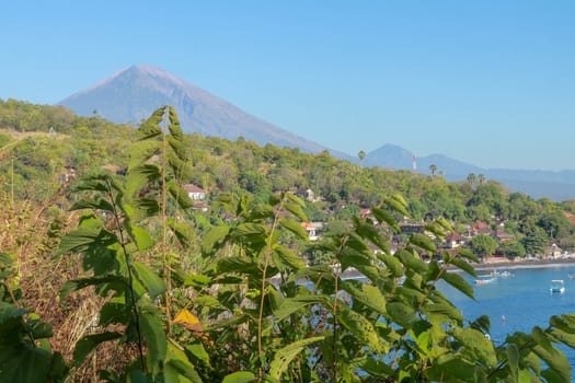 Beautiful view of Mount Agung and Mount Batur volcanos from a boat at Amed Beach, Bali, Indonesia.