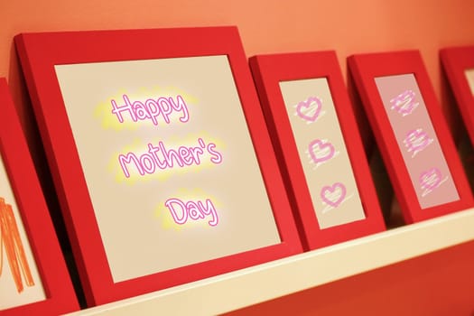 happy mother's day text on pink background with red frame, mother's day concept.