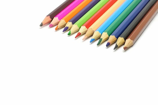 Closeup of coloured pencils isolated on white background.