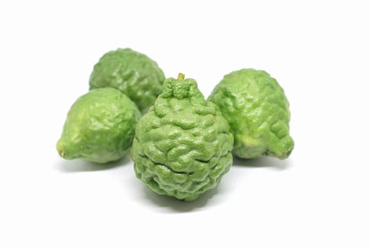 Fresh green Kaffir lime or Kaffir bergamot fruit isolated on white background, Kaffir lime is an important ingredient of food in Asia.