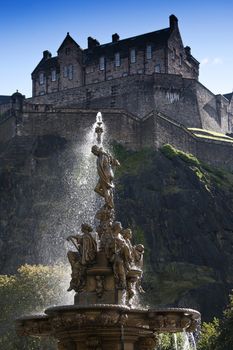 Edinburgh Castle with sunlight through Ross Fountain