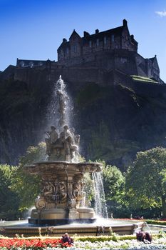 Edinburgh Castle with sunlight through Ross Fountain