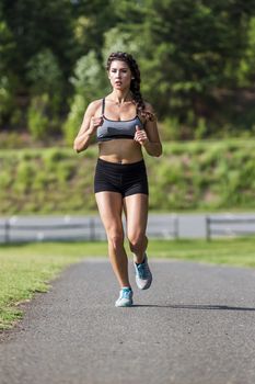 A gorgeous blonde fitness model working out in an outdoor environment