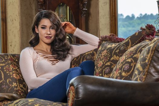 A gorgeous brunette model enjoys a day at home before work