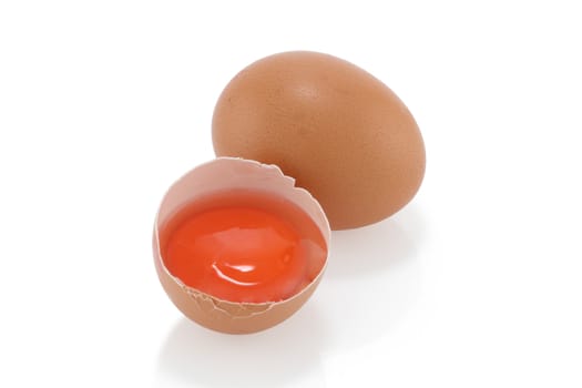 An egg and yolk on a white background