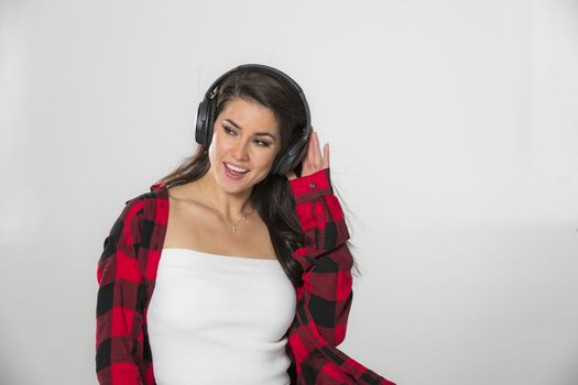 A gorgeous brunette model posing in a studio environment
