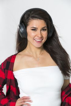A gorgeous brunette model posing in a studio environment
