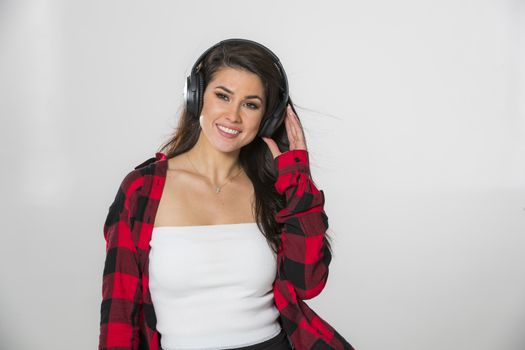 A gorgeous brunette model posing in a studio environment