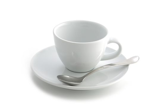 An empty white coffee cup and saucer and spoon isolated on a white background