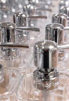 Close-up of empty dispensers for soap, gel and more.