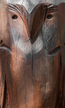 Carved wooden surface with the image of an owl. Ideal for concepts and backgrounds.