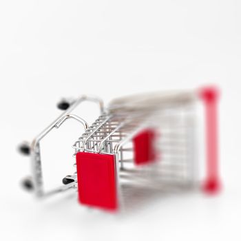 Blurry shopping cart. Conceptual representation of a failure, of poverty and being broke.