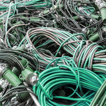 Mess of tangled old-style Christmas lights. Close-up.