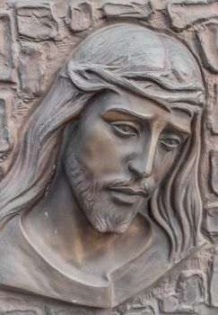 Bronze Bas-relief of Christ with a crown of thorns. Ideal for concepts and backgrounds.