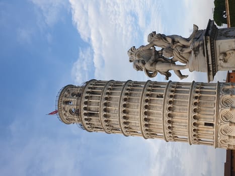 The leaning tower of Pisa and Piazza dei Miracoli in a sunny day - The Miracle Square, the Leaning Tower and the Cathedral is visited everyday by thousand of tourists - Pisa, Tuscany, Italy