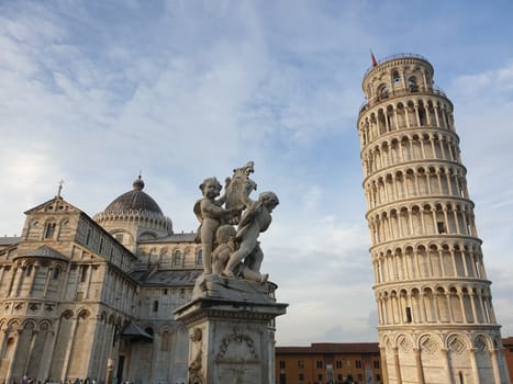 The leaning tower of Pisa and Piazza dei Miracoli in a sunny day - The Miracle Square, the Leaning Tower and the Cathedral is visited everyday by thousand of tourists - Pisa, Tuscany, Italy