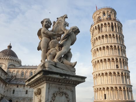 The leaning tower of Pisa and Piazza dei Miracoli in a sunny day - The Miracle Square, the Leaning Tower and the Cathedral is visited everyday by thousand of tourists - Pisa, Tuscany, Italy