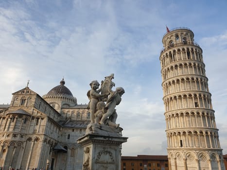 The leaning tower of Pisa and Piazza dei Miracoli in a sunny day - The Miracle Square, the Leaning Tower and the Cathedral is visited everyday by thousand of tourists - Pisa, Tuscany, Italy