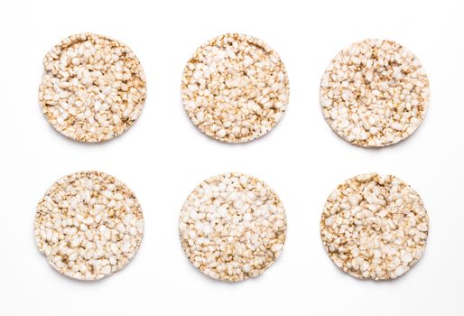 Six rice and spelled cakes isolated on white. Concept of healthy eating and diet.