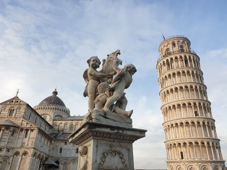 The leaning tower of Pisa and Piazza dei Miracoli in a sunny day - The Miracle Square, the Leaning Tower and the Cathedral is visited everyday by thousand of tourists - Pisa, Tuscany, Italy