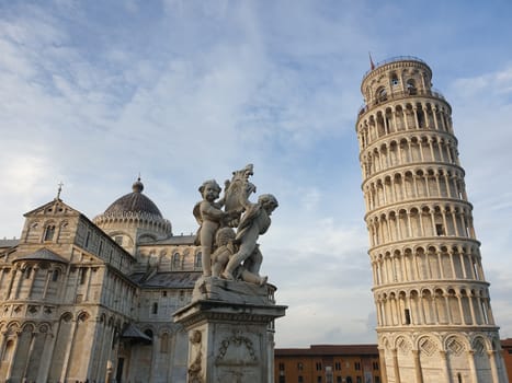 The leaning tower of Pisa and Piazza dei Miracoli in a sunny day - The Miracle Square, the Leaning Tower and the Cathedral is visited everyday by thousand of tourists - Pisa, Tuscany, Italy