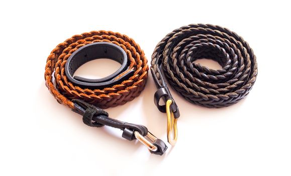 Two brown braided belts. Isolated on white background.
