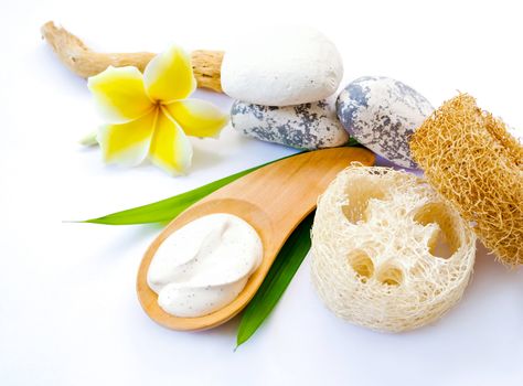 Scrub for beauty skin with salt cream, stone and luffa (natural fiber). spa treatment body care on white background.