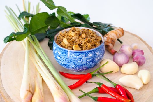 Thai cuisine (nam prik) or chili paste. thai southern style food with chilli, garlic, onion And lemongrass in Thai blue bowl.