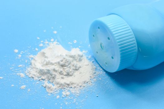 Baby talcum powder container on blue background