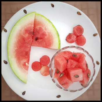 Chill pink color slices of watermelon with round shape cut pieces in white plate and good drink for summer days and healthy fruit and also to keep body hydrate drink