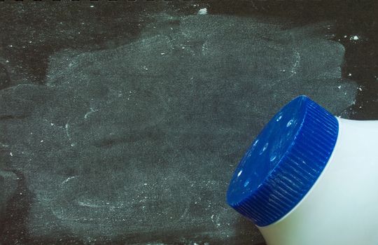 Baby talcum powder container on blue background