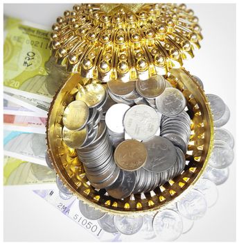 Indian new currency spread randomly with coins in golden color gift box beautifully and 500 rupees with rubber band