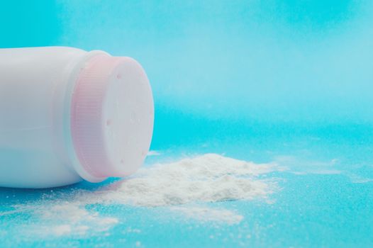 Baby talcum powder container on blue background