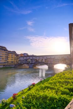 A view along the Arno River towards the Ponte Vecchio in Florence, Italy.