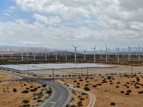 Aerial view of Genuine Energy Farm in the Hot Arid Desert of Palm Springs, California. Solar Panels farm to Harness the Power of Nature to generate free green energy.