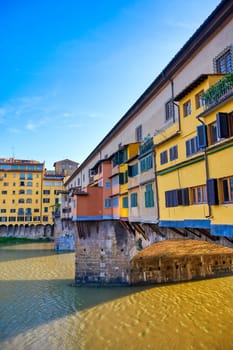 A view along the Arno River towards the Ponte Vecchio in Florence, Italy.