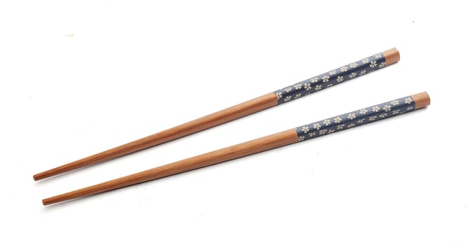 Two isolated wooden chopsticks on the white background