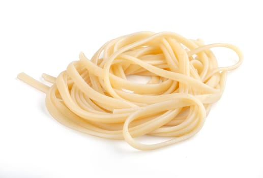 Handful of prepared linguini on the white