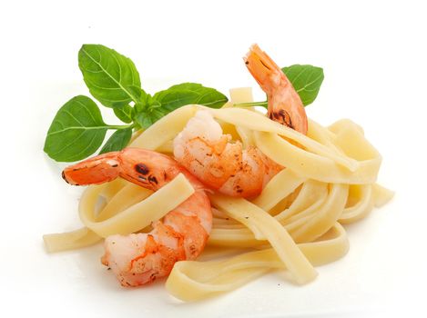 Roasted shrimps with pasta on the plate