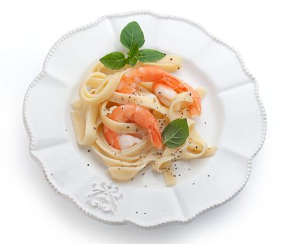 Boiled shrimps with pasta on the plate