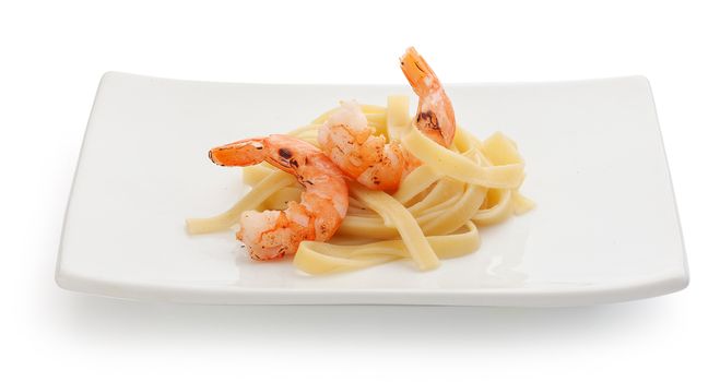 Roasted shrimps with pasta on the plate