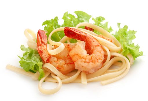 Fried shrimps with pasta and fresh green lettuce