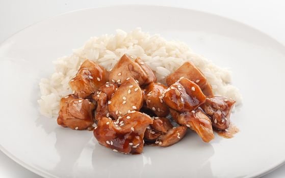 Fried chicken teriyaki with sesame on rice