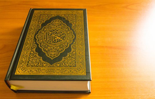 quran on the wooden table background